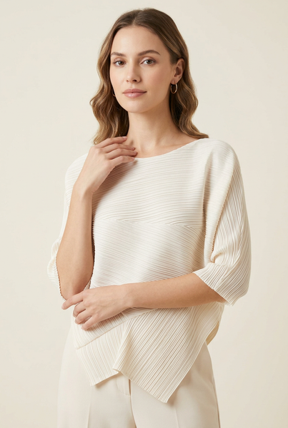 Model wearing the ivory pleated top