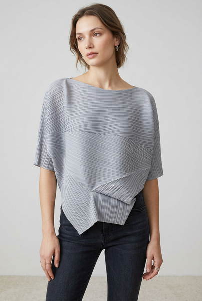 Model wearing the grey pleated top