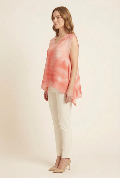 AI-generated model in side profile wearing the red sleeveless pleated top with shorter draped side hems and ivory trousers