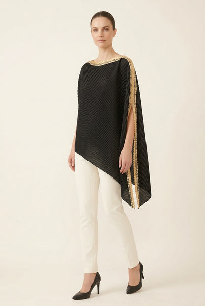 AI-generated model in a three-quarter pose wearing the black pleated asymmetric top with gold chain-pattern trim