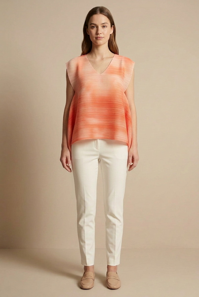 AI-generated model wearing a coral-orange pleated handkerchief-hem top with ivory trousers