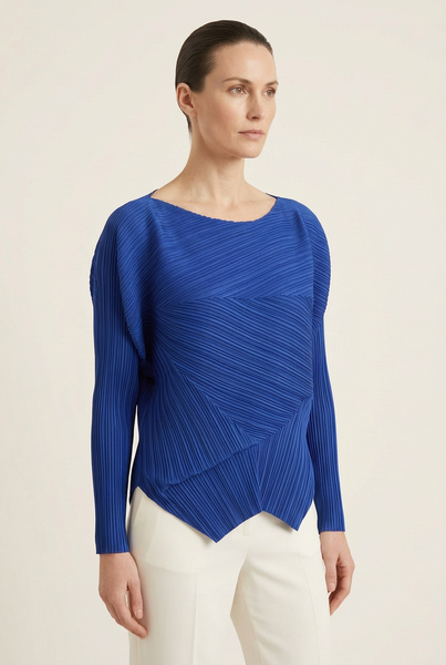 AI-generated model wearing the cobalt blue asymmetric drape pleated top, three-quarter pose